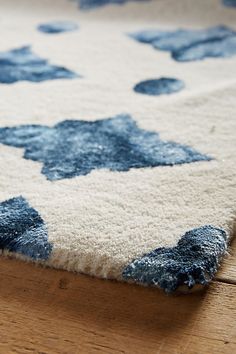 a blue and white rug on the floor