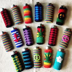 six crocheted flasks are arranged in rows