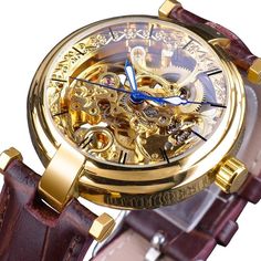 Firenze Skeleton Mechanical Watch has it all. You’ll have a front-row seat to the clockwork that tracks each moment, automatic movement and winding capability so you never have to worry about batteries again, and lastly,...a chic surgical-grade stainless steel case with a super sleek design. The 40mm case also features sapphire glass on the front and hardened mineral glass on the back. Presented on a top-grain leather strap. The luminous hands are bright blue which is a nice contrast against the background. Signature storage box included. Designed in Italy. Features: Water Resistance Depth: 3Bar Automatic Self-Wind Dimensions: Dial Diameter: 40 mm Band Width: 20 mm Band Length: 24 cm Case Thickness: 13 mm Case Shape: Round Materials: Case Material: Stainless Steel Dial window material: Min Steampunk Watches With Round Dial For Formal Occasions, Steampunk Automatic Watch For Formal Occasions, Steampunk Watches For Formal Occasions, Steampunk Style Formal Watches, Timeless Gold Chronograph Watch With Skeleton Dial, Gold Steampunk Watch With Skeleton Dial, Steampunk Watch With Skeleton Dial, Steampunk Watches With Metal Dial For Formal Occasion, Steampunk Formal Watch With Metal Dial