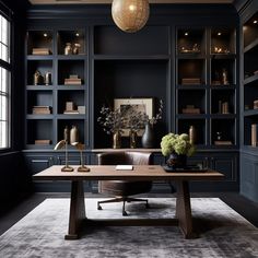 an office with black walls and leather chairs in front of a wooden desk surrounded by bookshelves