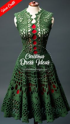 a crocheted green dress with red dots on the neck and bottom, is shown