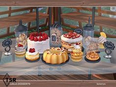 a table topped with lots of cakes and desserts