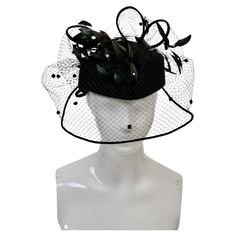 Mr. John was one of the preeminent American milliners during the mid twentieth century, closing up his elaborate New York salon sometime in the 1970s, although he continued to design hats for his private clientele until his death in 1993. This example of his work is a spectacular find and a show stopper. The main body, in black felt, has a rounded crown and has a subtle upside down boat shape; slightly pointed front and back, it sits directly on top of the head. What distinguishes this particula Hat With Veil, Black Felt, The 1970s, Clear Crystal, Veil, Embellishments, Accessories Hats, Felt, Fashion Accessories