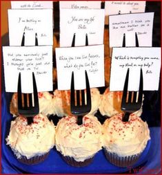 cupcakes with forks and notes attached to them