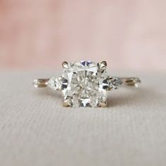 an engagement ring with three stones on it