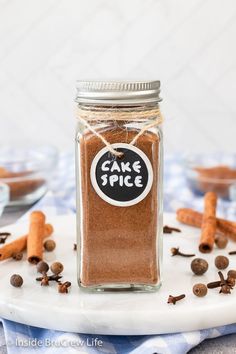 a jar filled with cinnamon spice sitting on top of a table