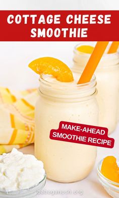 two mason jars filled with cottage cheese smoothie next to orange slices and whipped cream