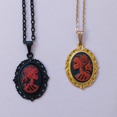 "These red skeleton silhouette cameo necklaces are ready to ship tomorrow.  They're available in either black brass or gold plated settings.  The spooky skull cameo pendants are red, black and small (only about an inch long - maybe 25 mm.)   Like everything else here in HollysPrivateIdaho, these were made with love in a smoke-free home. I carry other Halloween jewelry here in this shop. Check out my \"Whimsigoth Jewelry\" section to see the others 👻.  Just use this link: www.etsy.com/shop/Holly Whimsigoth Jewelry, Skeleton Silhouette, Red Skeleton, Skull Cameo, Cameo Pendant Necklace, Goth Style, Cameo Necklace, Cameo Pendant, Halloween Jewelry