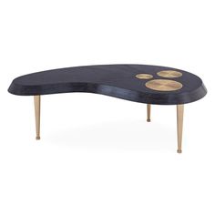 a black table with gold circles on it and two small holes in the top,