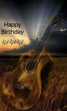 a guitar is in the middle of a field with music notes on it, and says happy birthday