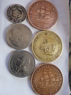 five different types of coins sitting on top of each other