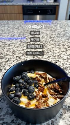 a pan filled with blueberries and yogurt on top of a kitchen counter