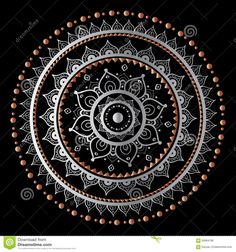 an intricate circular design on a black background with orange dots and circles in the center