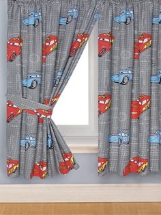 a window curtain with cars and trucks on it