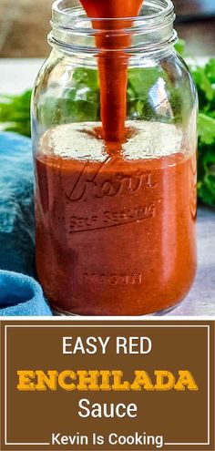 an easy red enchilada sauce is being poured into a mason jar