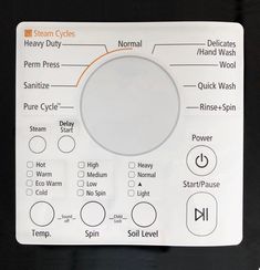 a close up of a control panel with buttons and symbols