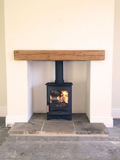 a wood burning stove in a white room