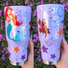 two hand painted tumbles with ariel the mermaid and floundy fish on them