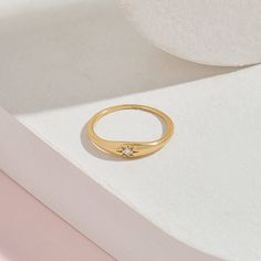 The Iconic Diamond Signet Star Ring is the pinnacle of minimalist design and elegant rings. Its plainness with modesty which is embellished with a single diamond will fascinate people around you. It is perfect for everyday use and ring stacking. - Made in 14k Solid Gold - Decorated with handset 0.025 ctw white diamond on 14k solid gold - Diamond Color and Clarity: G Color SI clarity - Top Width: 4.13 mm / 0,16 inches- Bottom Width: 1,45 mm / 0,06 inches- Thickness: 1.23 mm / 0,05 inches - This p Elegant Star-shaped Crystal Promise Ring, Minimalist Crystal Ring With Polished Finish, Elegant Diamond Star Signet Ring, Elegant Diamond Star-shaped Signet Ring, Elegant Star-shaped Diamond Signet Ring, Minimalist White Gold Star-shaped Ring, Minimalist Star-shaped White Gold Rings, Minimalist White Gold Star Shaped Ring, Minimalist Diamond Crystal Ring