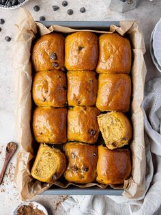 a pan filled with muffins sitting on top of a table