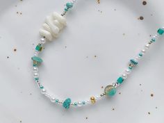 A beautiful blue color palette to express yourself in. This beaded necklace features natural shell, turquoise beads and Japanese seed beads for a distinctive finish. It is a great stand alone piece and I like to layer it with simple silver chains too! 🌹 Measurement: ➺ Overall length: 14.5 inch + 2.3 inch extension chain (37cm + 6cm) ✉️ Shipping: Canada: Untracked oversized lettermail handled by Canada Post: arrives in 5-15 business days. US: Tracked parcel handled by USPS: arrives in 5-15 busin Beaded Shell, Blue Color Palette, Silver Chains, Blue Colour Palette, Summer Necklace, Canada Post, Shell Beads, Turquoise Beads, Necklace For Women