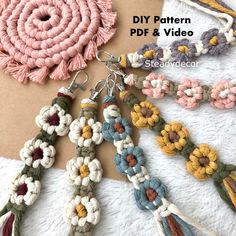 several crocheted flowers and tassels are arranged together