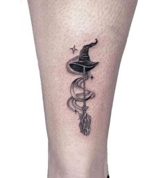 a black and white photo of a person's leg with a tattoo on it