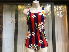 Vintage 60s or 70s floral swim wear. Has built in bra. Good vintage condition. No size labeled but fits like small to medium - please see measurements. Measurements taken across front laid flat  15" armpit to armpit 12" across waist 16" hips 26" length Retro Fitted Summer Tankini, Retro Summer Swimwear Lined, Retro Fitted Floral Print Swimwear, Retro Lined Swimwear For Summer, Retro Sleeveless Tankini For Beach Season, Retro Floral Print Swimwear, Retro Floral Print Swimwear For Summer, Retro Summer Tankini For Swimming, 60s Floral