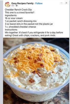 a bowl of dip with cheese and bacon on top