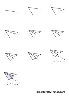 paper airplanes are flying in the sky and one has an arrow on its side, while another