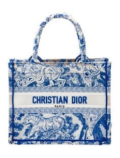 Christian Dior ToteFrom the 2022 Collection by Maria Grazia ChiuriBlue CanvasGraphic PrintToile de JouyRolled HandlesEmbroidered AccentUnlinedOpen Top Christian Dior Tote, Dior Summer, Dior Women, Christian Dior Paris, Dior Paris, Embroidered Handbag, Christian Dior Fashion, Book Tote Bag, Dior Book Tote