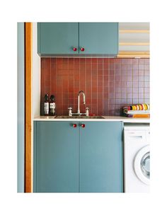 the kitchen is clean and ready to be used as a washer and dryer