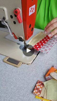 a person using a sewing machine to sew fabric