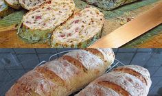 there are several different types of breads on the table and one is sliced up