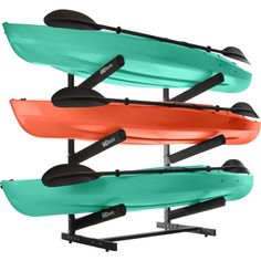 three kayaks are mounted on the wall and ready to be used in water sports