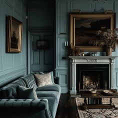 a living room filled with furniture and a fire place in front of a painting on the wall