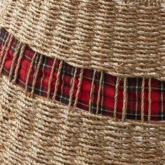 a close up view of some woven material with red and black plaid on the side