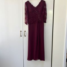 Burgundy Floor Length Evening Gown With Lace Detail On Top And Subtle Beading. Lace Sleeves Burgundy Nightgown, Burgundy Floor-length Evening Dress, Burgundy Floor-length Evening Maxi Dress, Burgundy V-neck Maxi Dress, Lace Sleeves, Lace Detail, Lady In Red, Floor Length, Evening Gowns