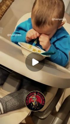 a little boy sitting in a high chair eating from a plate with his hands on his face