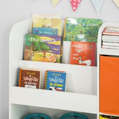 children's books are displayed on the shelf