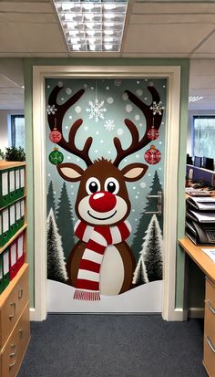 an office decorated for christmas with reindeers and snowflakes on the glass door