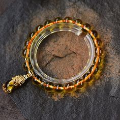 Attract A Never-Ending Flow Of Good Luck, And Wealth Wearing This Lucky Pixiu Citrine Bracelet. This is a beautifully hand crafted LUCK & WEALTH bracelet of Citrine Beads and a cute pixiu ('pie-shoe') charm. Citrine has been known as the stone of wealth in Feng Shui, due to its potency to attract abundance and money luck. Citrine is believed to be of value in healing the spiritual self as well as being a powerful cleanser and regenerator. It carries the virtues of self-healing, inspiration and s Handmade Crystal Bracelet For Meditation, Yellow Beaded Jewelry For Meditation, Spiritual Yellow Jewelry With 8mm Beads, Crystal Bangle Bracelet With 8mm Beads As Gift, 8mm Beads Crystal Bangle Bracelet As Gift, Gift Crystal Bangle Bracelet With 8mm Beads, Gift Rosary Bracelet With 8mm Round Beads, Gift Rosary Bracelet With 8mm Beads, 108 Beads Round Bracelet For Meditation