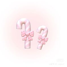 two candy canes shaped like the letters p and f on a light pink background