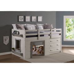 a white bunk bed with two dogs in the bottom drawer and an open door leading to another room