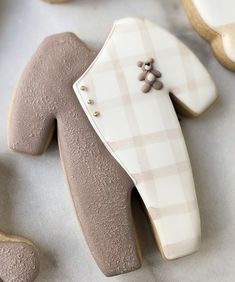 decorated cookies in the shape of people's legs and feet with teddy bears on them