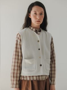 Editor's NotesThis is the 'tig button vest' from Monochrome, a piece that beautifully encapsulates a vintage autumn mood. This vest features a regular fit and a basic silhouette, making it ideal for layering.- Made from jersey fabric, providing durability and a strong structure- The use of various sizes and colors of natural buttons made from wood, nuts, and buffalo horn- Reflecting Monochrome's characteristic styleMeasurements(in.)One Size(XS-M)- Shoulder: 15.94 in.- Chest: 19.88 in.- Hem: 19.69 in.- Length: 20.20 in.* Model Info: Height 5' 84 Top Korean 55Composition & Care- 95% Cotton, 5% Polyester- HAND WASH ONLY (Neutral detergent / In cold water) / DO NOT USE DRYERDesigner- by MONOCHROME Button-up Cotton Vest For Fall, Casual Button Closure Vest For Fall, Casual Fall Vest With Button Closure, Casual Vest With Button Closure For Fall, Fall Denim Vest With Button Closure, Cotton Button-up Vest With Buttons, Classic Fall Vest With Buttons, Spring Vest With Button Closure For Layering, Casual Button-up Vest For Work