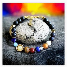 *This unique accessory features nine distinct beads, each meticulously chosen to represent the celestial bodies of our captivating solar system: Mercury, Venus, the Moon, Earth, Mars, Jupiter, Saturn, Uranus, and Neptune. Handmade Universe Galaxy the Eight Planets Gemstone Bracelet *Indulge in the celestial allure of our solar system bracelet, a remarkable testament to the wonders of the universe. *Meet the miracles of natural stones without sacrificing your elegance.I make it every day, so ship Celestial Adjustable Charm Bracelet Gift, Symbolic Adjustable Jewelry With Natural Stones, Adjustable Symbolic Gemstone Bracelet, Adjustable Symbolic Gemstone Bracelets, Adjustable Symbolic Gemstone Beaded Bracelets, Symbolic Natural Stone Beaded Bracelets, Symbolic Natural Stone Beaded Bracelets With Round Beads, Symbolic Beaded Bracelets With Natural Stones, Symbolic Round Gemstone Beads Bracelet