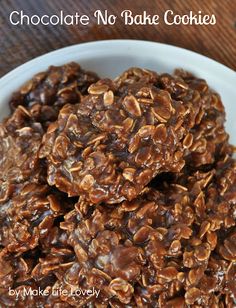 a bowl filled with granola cookies on top of a table