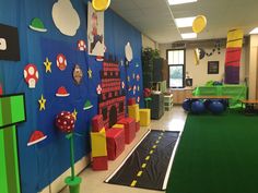 an indoor play area with toys and decorations on the walls, along with green carpeted flooring