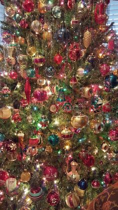 a christmas tree with many ornaments on it